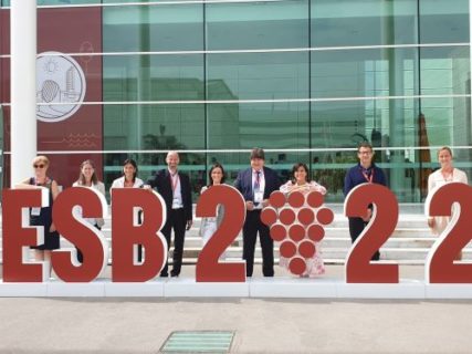 YSF members standing by the ESB2022 sign