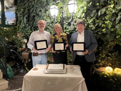 Prof. Boccaccini standing the symposium organizers with their diplomas