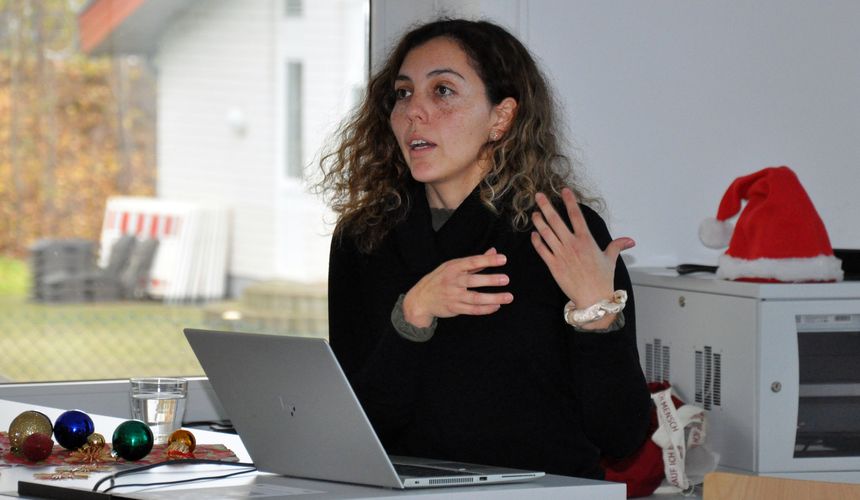 Dr. Aldana and Prof. Boccaccini standing next to her presentation