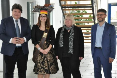 Vera standing with Prof. Boccaccini and the examiners after the defense.