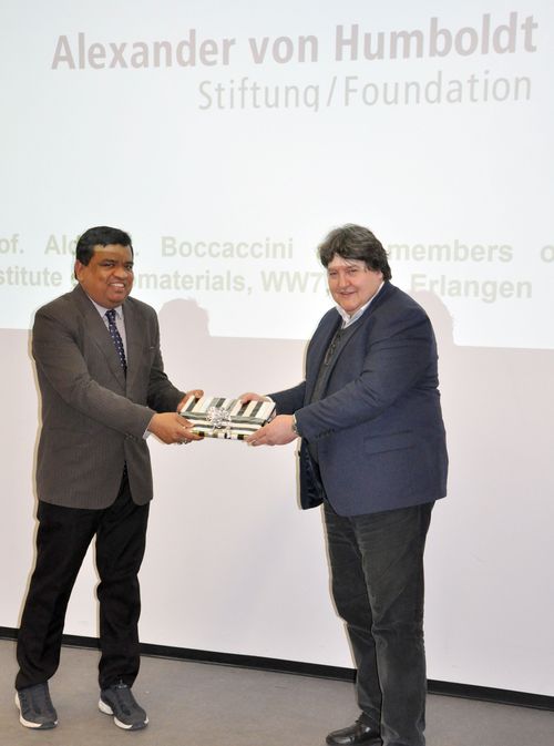 Prof. Boccaccini and Prof. Basu standing in front of Prof. Basu's presentation