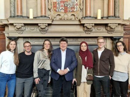 Prof. Boccaccini standing in the lecture hall with the Early Stage Researchers