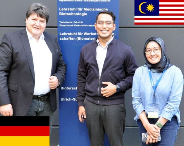 Prof. Boccaccini standing outside the institute with Assoc. Professor Mahat and Nur Syifaa Razak