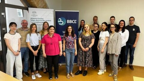 Faina, Jonas and Zhiyan standing with the BBCE members.