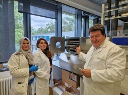 Prof. Boccaccini, Dr. Pourshahrestani and Ms. Akhtar standing next to the freeze dryer