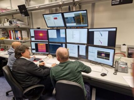 Prof. Boccaccini, Mr- Roder and Dr. Conceição sitting in front of a group of screens.