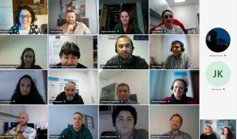 Screenshot of a zoom meeting with many participants with their cameras on.