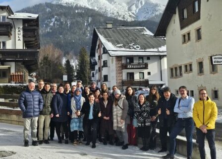 Image of the entire P4FIT group standing outside, in front of a snowy mountain.