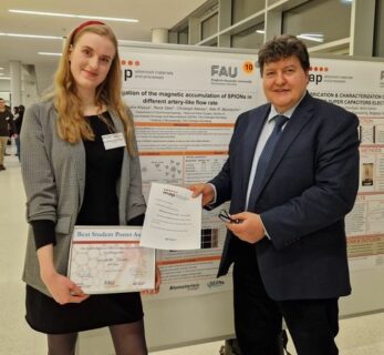 Prof. Boccaccini standing next to Ms. Klassa, holding her diploma.