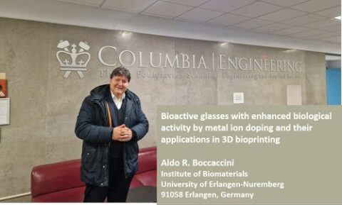 Prof. Boccaccini in front of a sign with the University name.