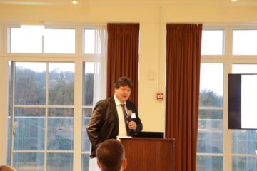 Prof. Boccaccini standing at the podium during his presentation.