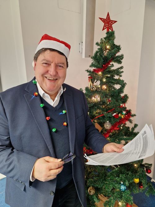 Prof. Boccaccini smiling near the Christmas tree