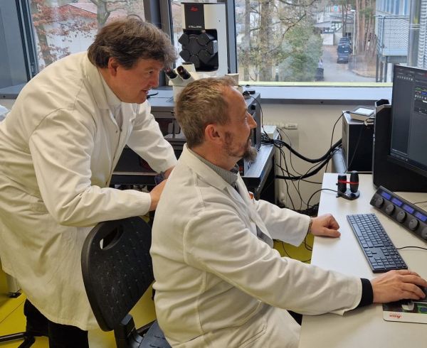 Prof. Boccaccini with Dr. Detsch cheking the microscope